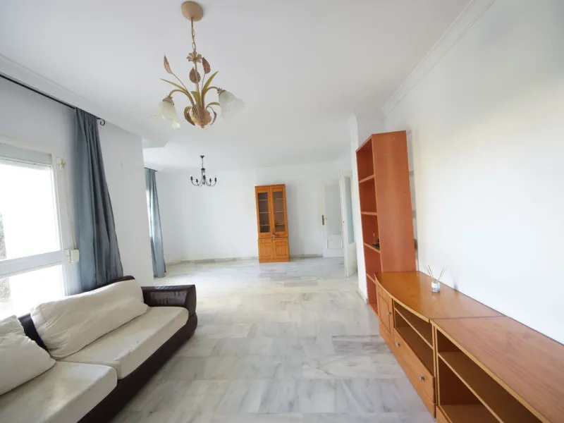 Spacious ground-floor apartment in a residential complex with a pool.