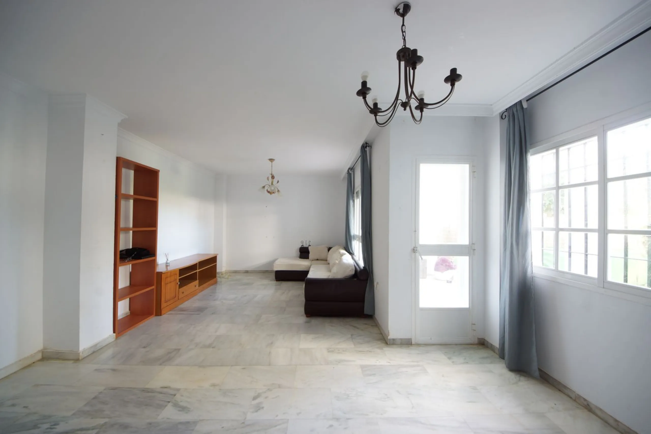 Spacious ground-floor apartment in a residential complex with a pool.