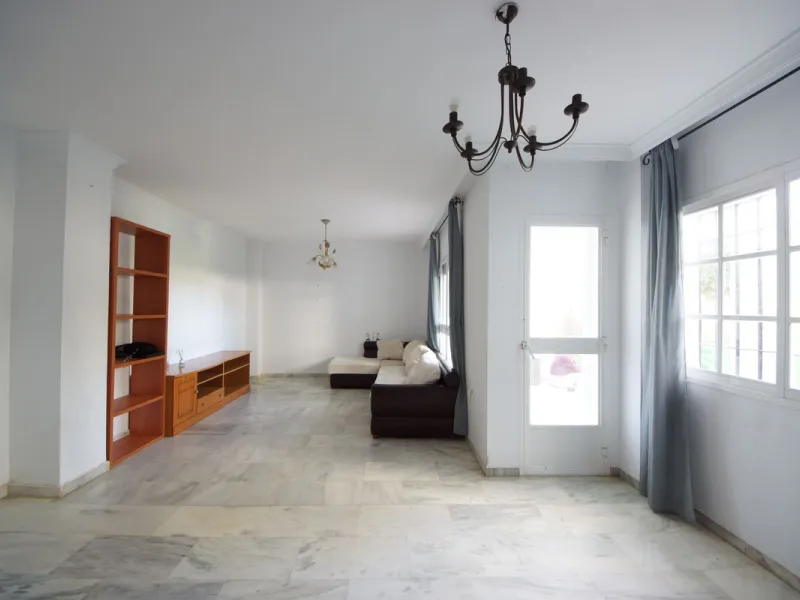 Spacious ground-floor apartment in a residential complex with a pool.