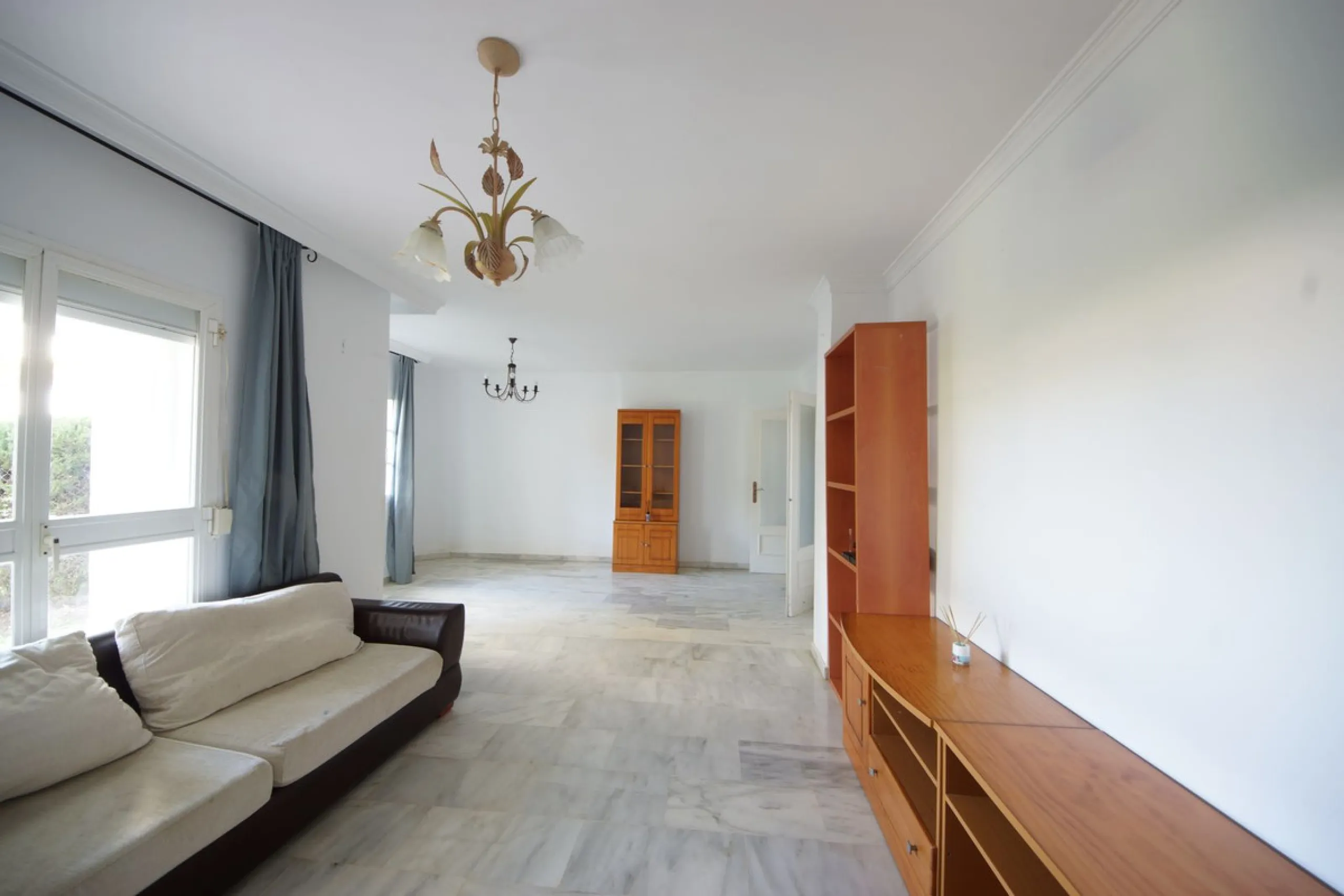 Spacious ground-floor apartment in a residential complex with a pool.