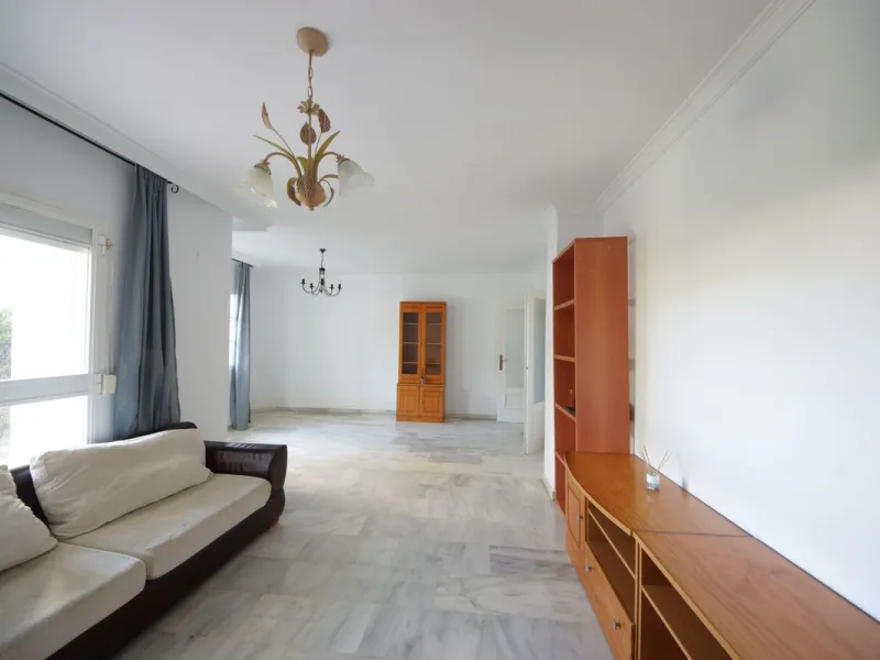 Spacious ground-floor apartment in a residential complex with a pool.