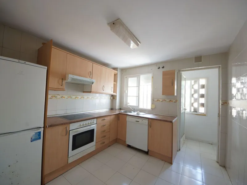 Spacious ground-floor apartment in a residential complex with a pool.