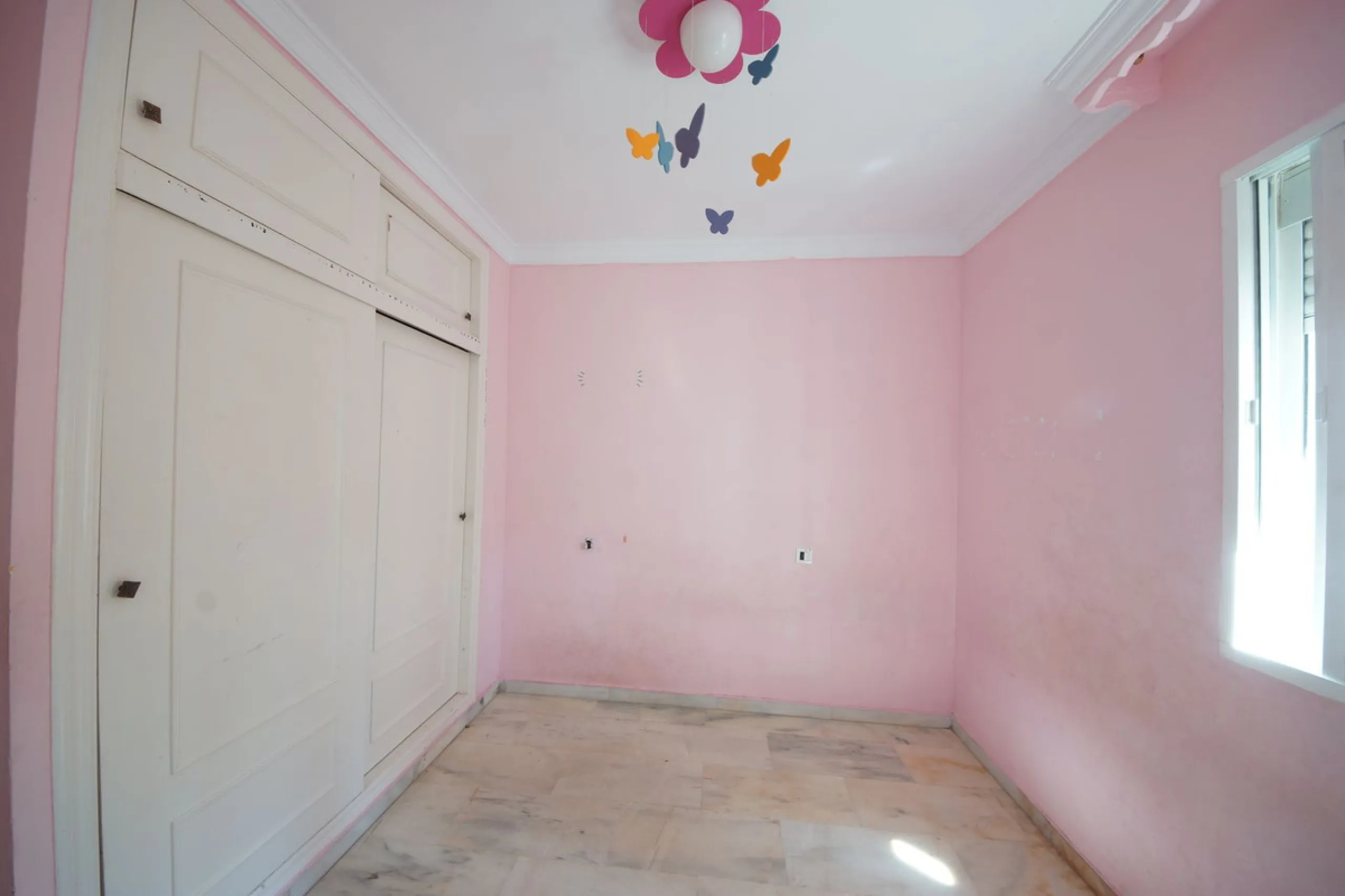 Spacious ground-floor apartment in a residential complex with a pool.