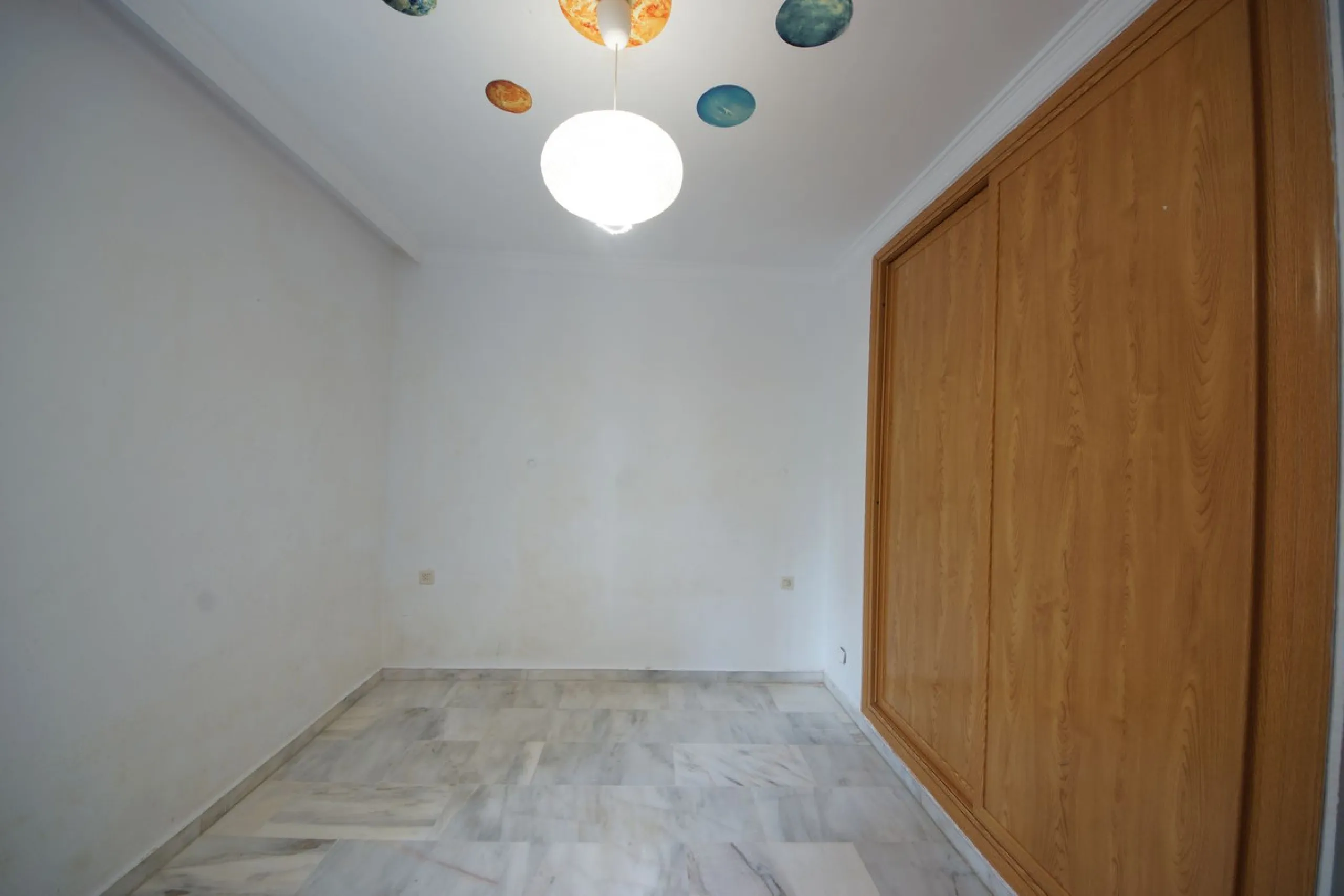 Spacious ground-floor apartment in a residential complex with a pool.