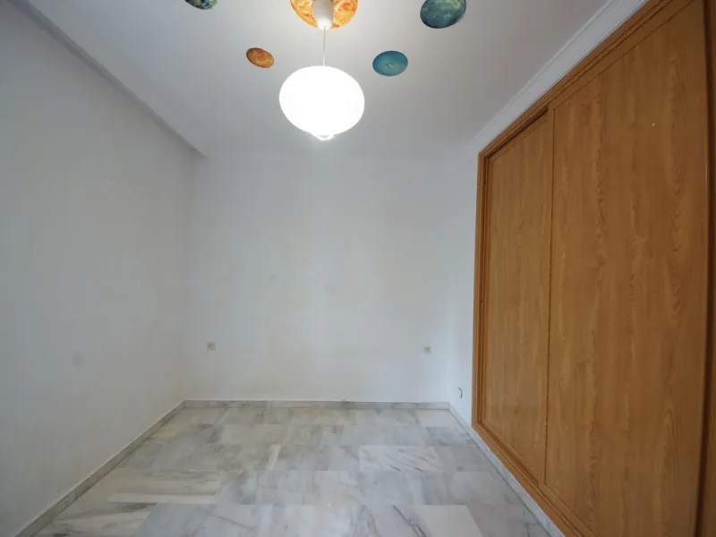 Spacious ground-floor apartment in a residential complex with a pool.
