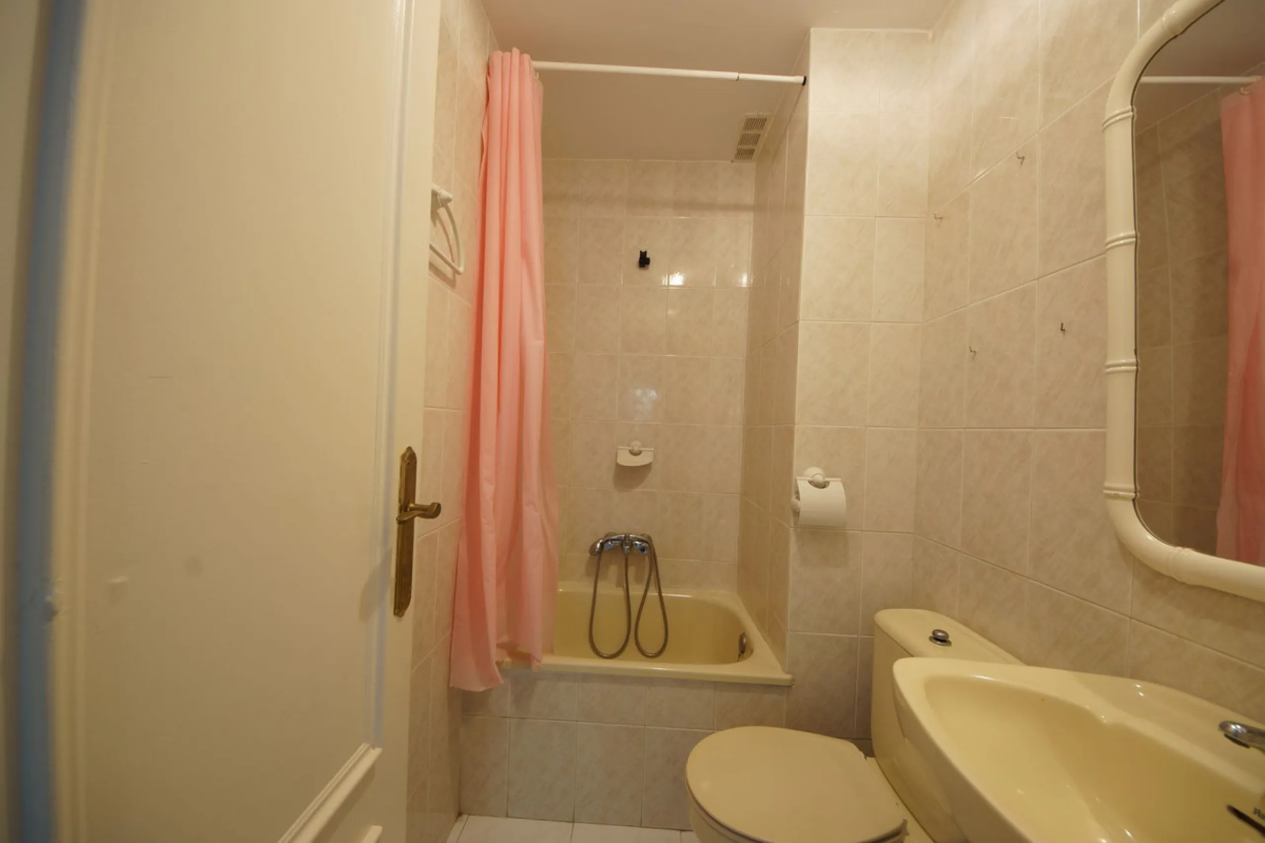 Spacious ground-floor apartment in a residential complex with a pool.
