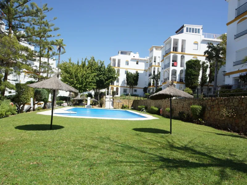 Spacious ground-floor apartment in a residential complex with a pool.