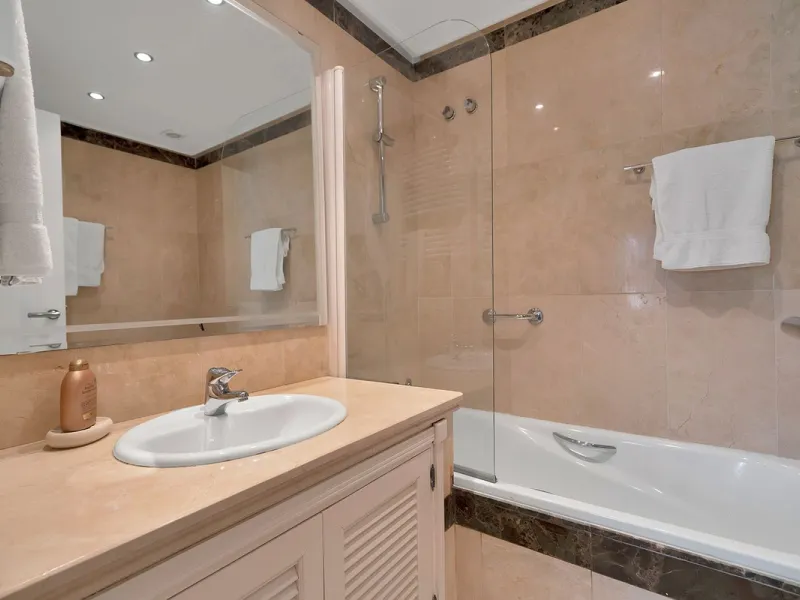 Discover seaside serenity in Estepona's ever popular complex - Dominion Beach located on the New Golden Mile. This spacious 2-bedroom, 2-bathroom apartment puts you just steps from the sand, with no road noise to disrupt the tranquility. The apartment is 
