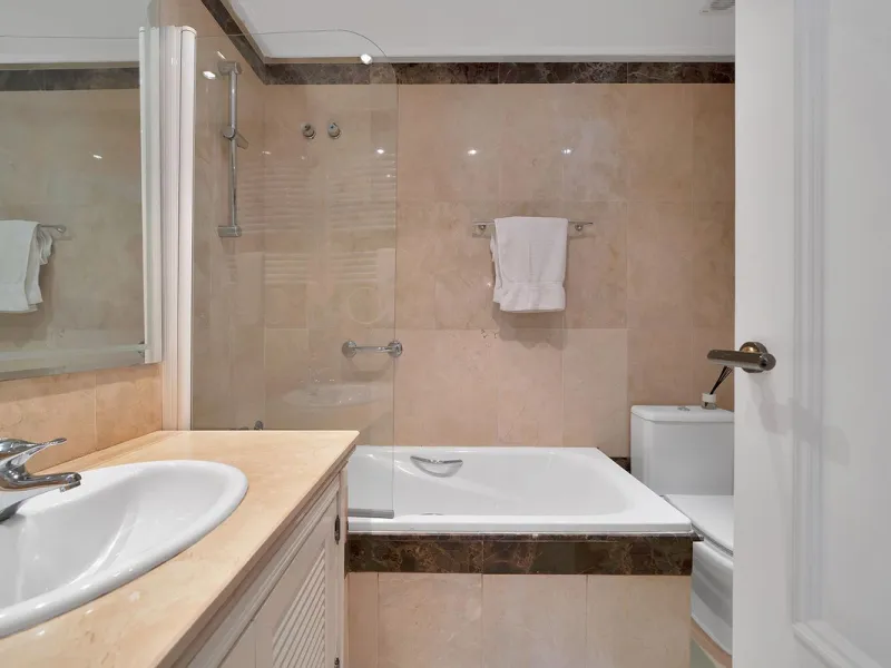 Discover seaside serenity in Estepona's ever popular complex - Dominion Beach located on the New Golden Mile. This spacious 2-bedroom, 2-bathroom apartment puts you just steps from the sand, with no road noise to disrupt the tranquility. The apartment is 