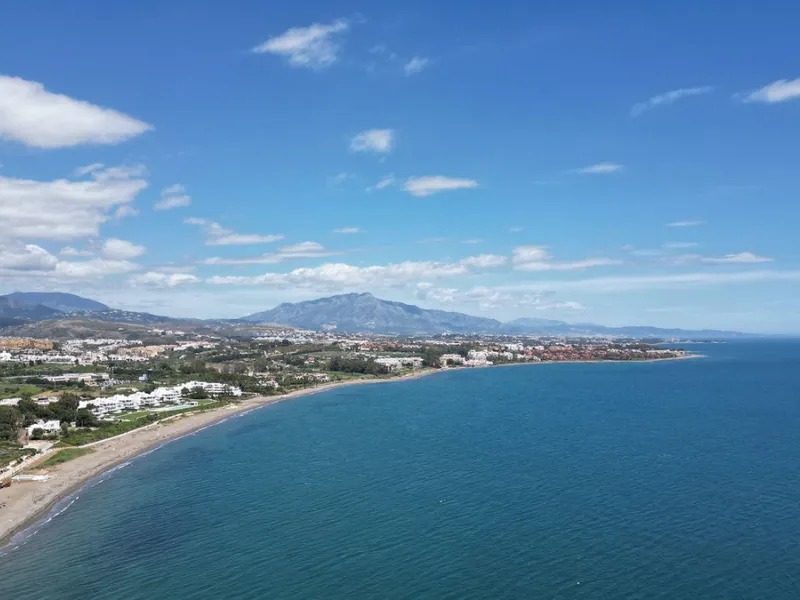 Discover seaside serenity in Estepona's ever popular complex - Dominion Beach located on the New Golden Mile. This spacious 2-bedroom, 2-bathroom apartment puts you just steps from the sand, with no road noise to disrupt the tranquility. The apartment is 