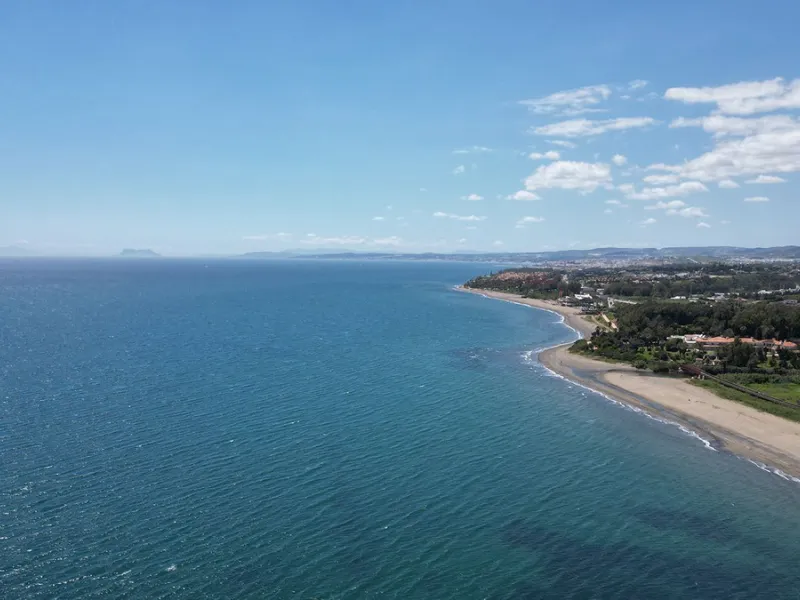 Discover seaside serenity in Estepona's ever popular complex - Dominion Beach located on the New Golden Mile. This spacious 2-bedroom, 2-bathroom apartment puts you just steps from the sand, with no road noise to disrupt the tranquility. The apartment is 