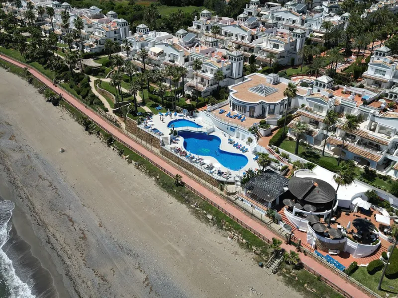 Discover seaside serenity in Estepona's ever popular complex - Dominion Beach located on the New Golden Mile. This spacious 2-bedroom, 2-bathroom apartment puts you just steps from the sand, with no road noise to disrupt the tranquility. The apartment is 