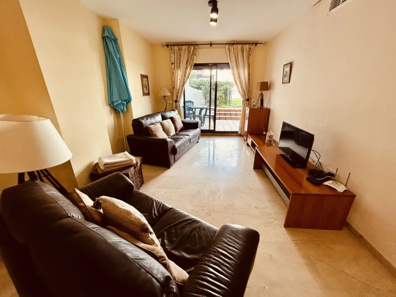 A charming garden apartment on a fantastic community with direct access to Duquesa Marina and the beautiful sandy beach.