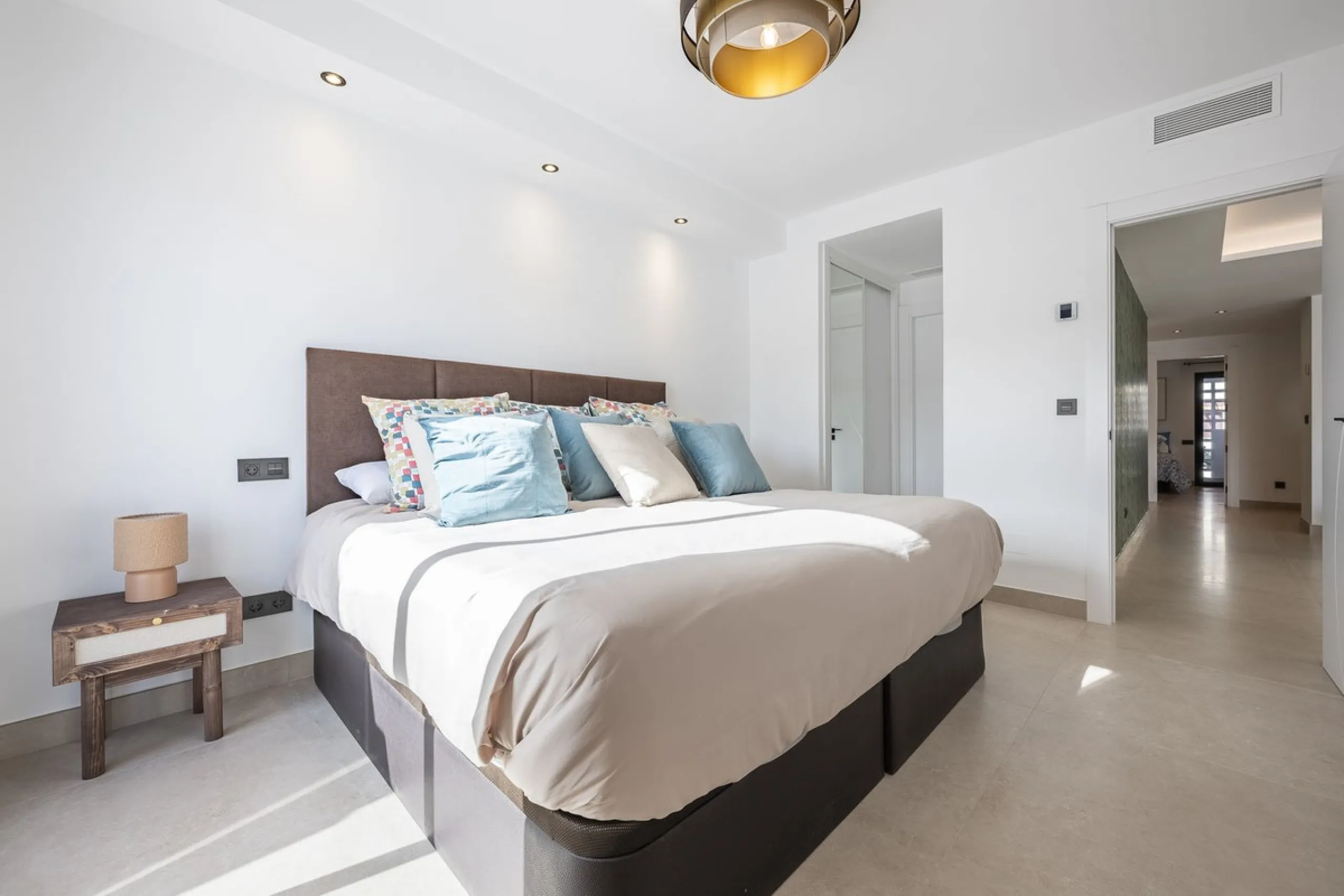 Luxury renovation in Nueva Andalucia. Top quality refurbishment with underfloor heating in the bathrooms and modern fire place.  In la Maestranza, a closed development with 24 hours security, very well maintained gardens and green areas with 2 pools (one 
