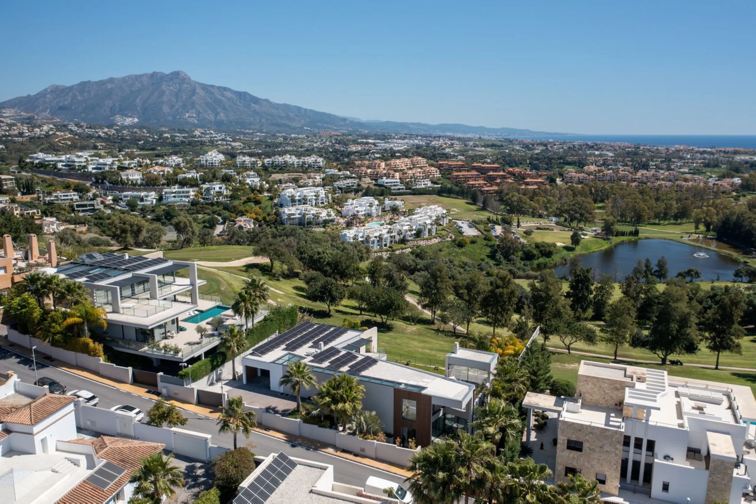 Newly built contemporary villa situated in the prestigious urbanization of La Alquería, Benahavís. Positioned frontline golf and facing east to south, the property offers panoramic views of the Mediterranean Sea, the coastline, and the iconic La Concha mo