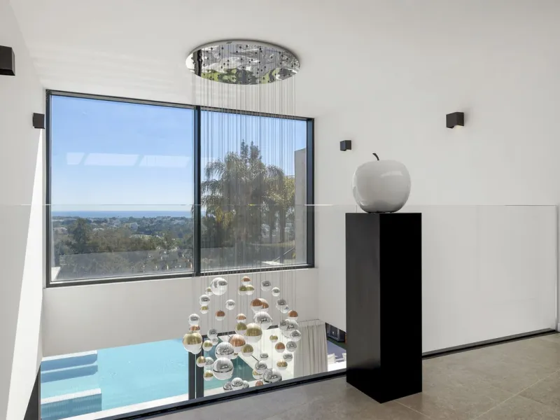 Newly built contemporary villa situated in the prestigious urbanization of La Alquería, Benahavís. Positioned frontline golf and facing east to south, the property offers panoramic views of the Mediterranean Sea, the coastline, and the iconic La Concha mo