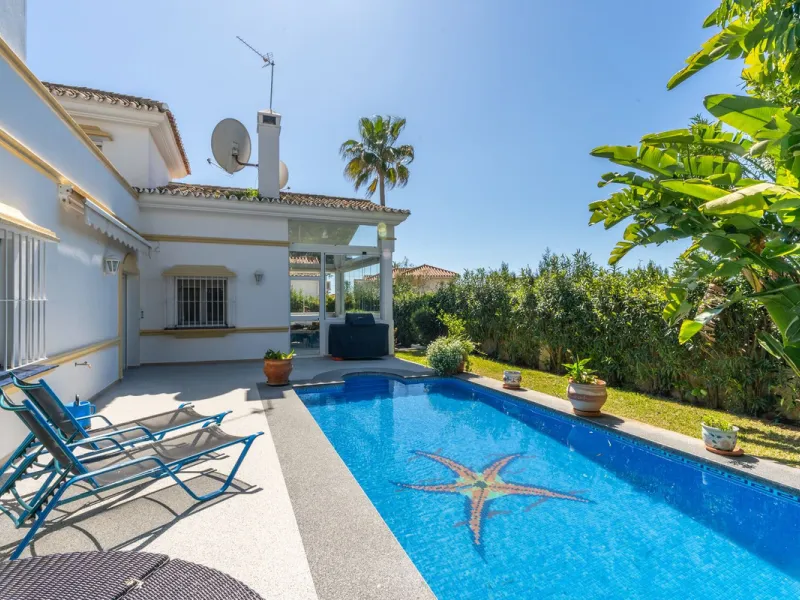 Located in the peaceful, secure residential area of Marbesa, this warm Mediterranean-style villa offers the perfect blend of comfort, privacy, and convenience. Just a 1-minute walk from the beach, close to all amenities, and only a short drive to Marbella