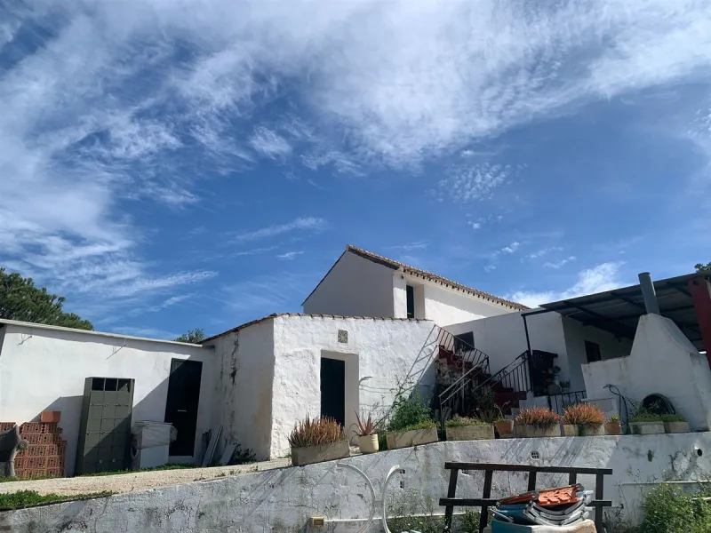 A finca in Mijas Almarchar with 19,200m² of irrigated land, including 3,000m² designated for urban development. The property features a country house that's ideal for renovation or redevelopment. The rural land is planted with olive and fruit trees, and o