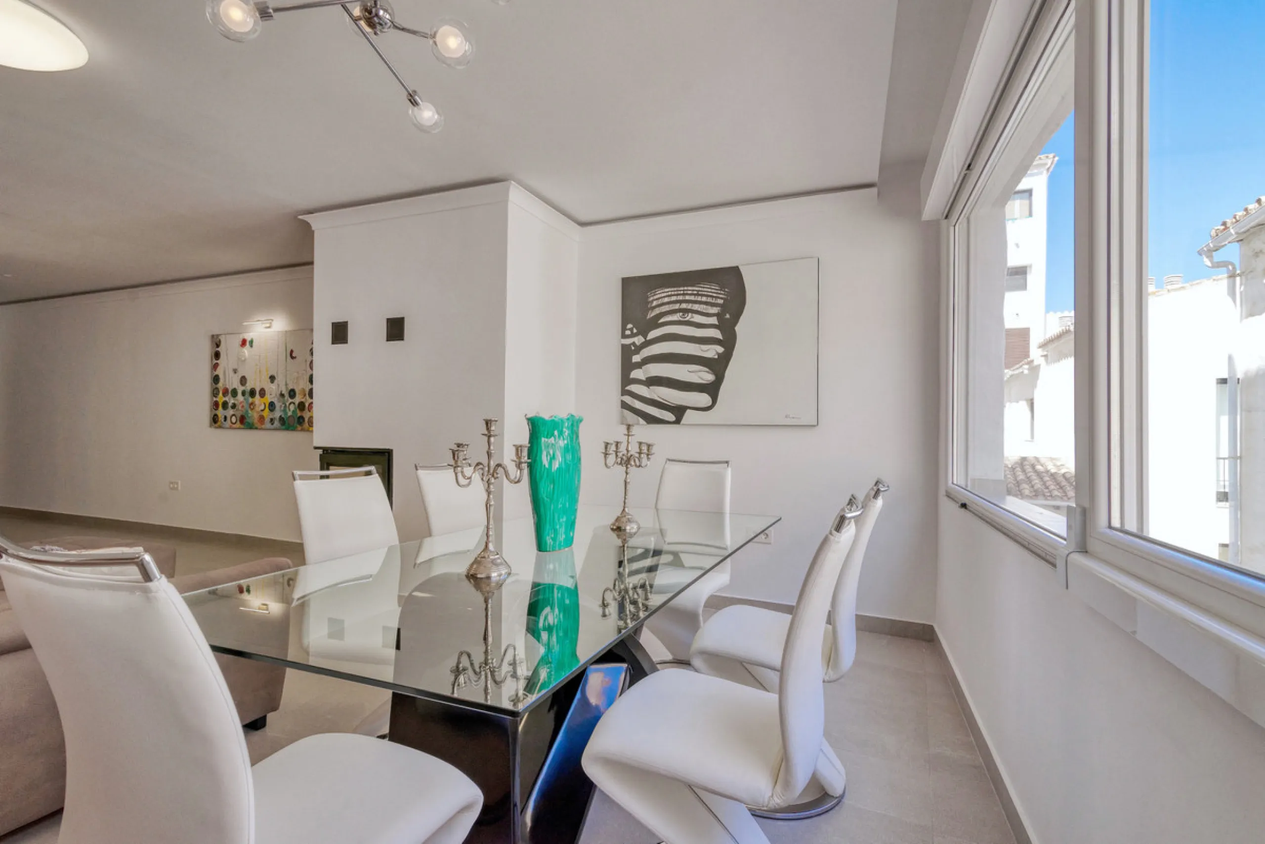 Presenting a perfectly finished Puerto Banus apartment, within steps of the bustling port but situated in a location that ensures tranquility. The home is accessed from the ground floor level by a lift that arrives within steps of the front door of this l