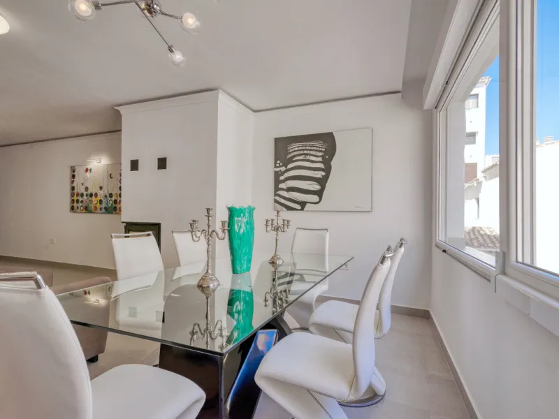 Presenting a perfectly finished Puerto Banus apartment, within steps of the bustling port but situated in a location that ensures tranquility. The home is accessed from the ground floor level by a lift that arrives within steps of the front door of this l