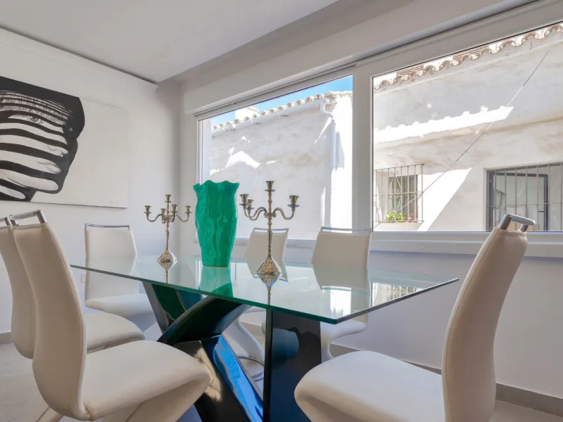 Presenting a perfectly finished Puerto Banus apartment, within steps of the bustling port but situated in a location that ensures tranquility. The home is accessed from the ground floor level by a lift that arrives within steps of the front door of this l