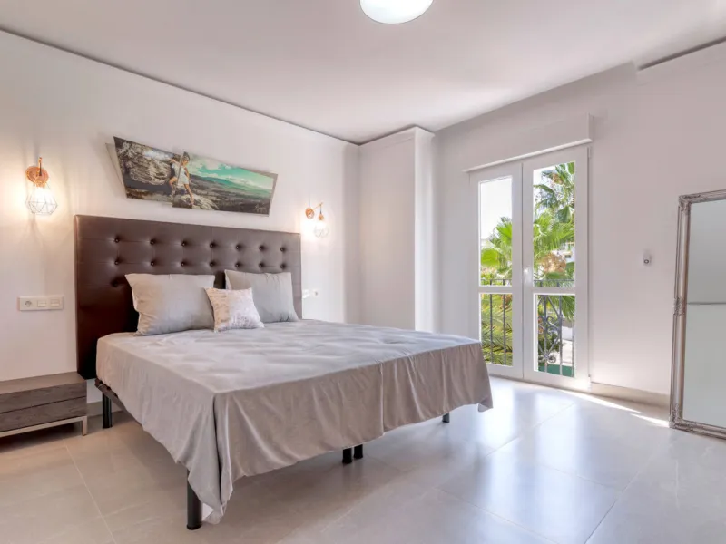 Presenting a perfectly finished Puerto Banus apartment, within steps of the bustling port but situated in a location that ensures tranquility. The home is accessed from the ground floor level by a lift that arrives within steps of the front door of this l