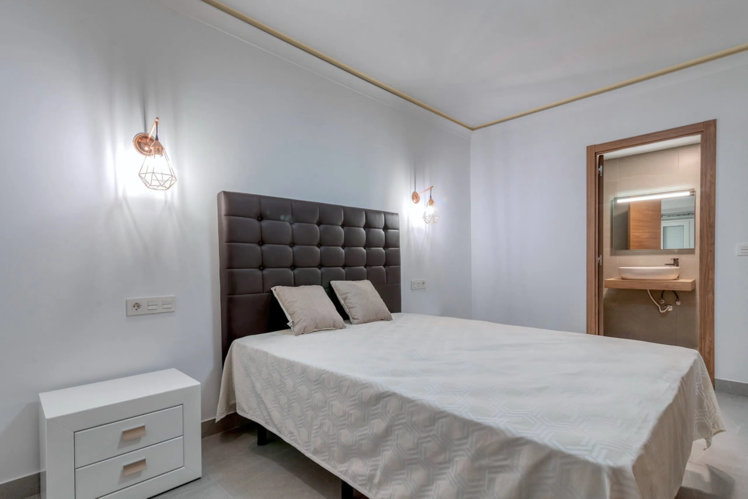 Presenting a perfectly finished Puerto Banus apartment, within steps of the bustling port but situated in a location that ensures tranquility. The home is accessed from the ground floor level by a lift that arrives within steps of the front door of this l
