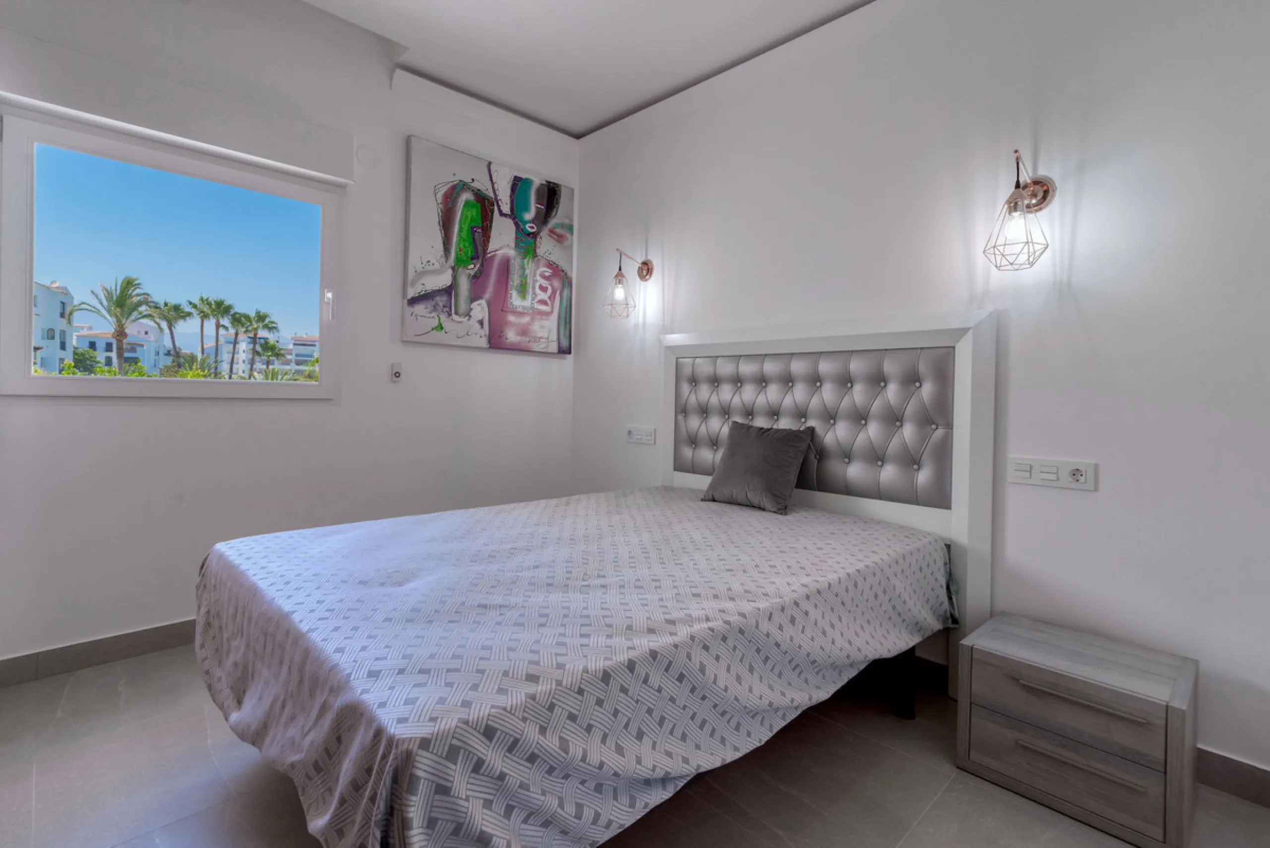 Presenting a perfectly finished Puerto Banus apartment, within steps of the bustling port but situated in a location that ensures tranquility. The home is accessed from the ground floor level by a lift that arrives within steps of the front door of this l