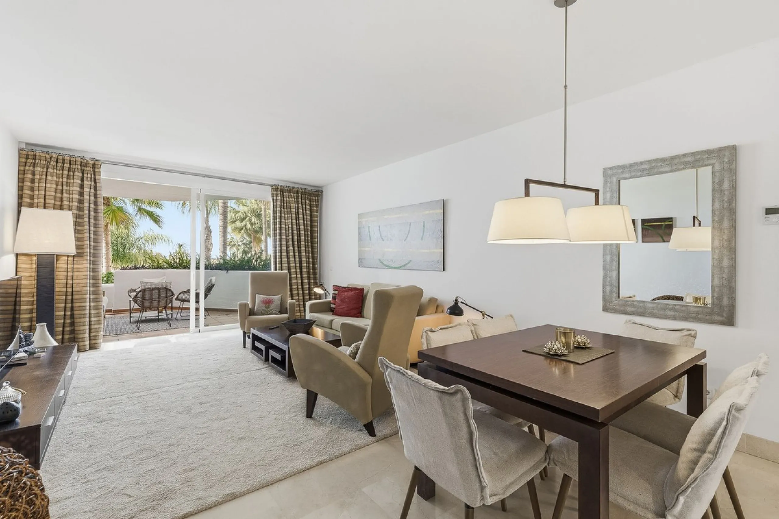This beautifully presented south-facing three-bedroom ground floor apartment is located in one of the most sought-after communities in Nueva Andalucía, Las Tortugas de Aloha. The property has been furnished to a high standard throughout, combining comfort