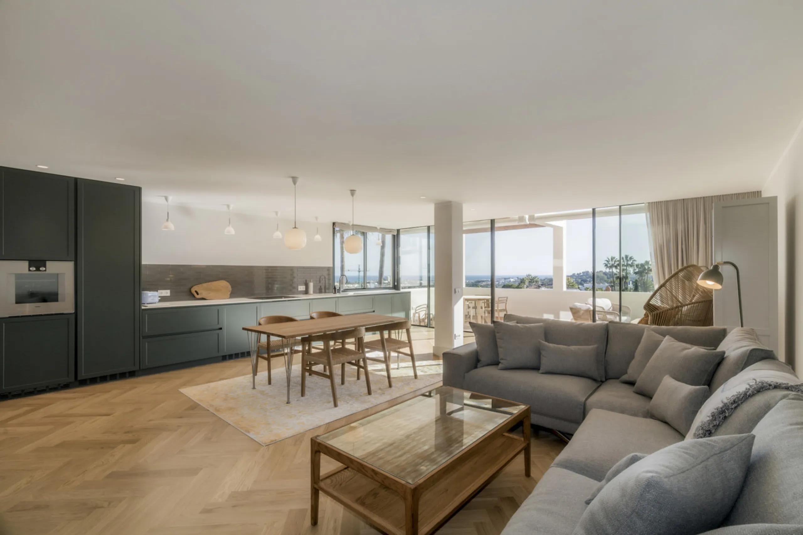 Step into luxury with this newly renovated 2-bedroom, 2-bathroom middle-floor apartment in the heart of Nueva Andalucía. Designed for modern living, it features a state-of-the-art Gaggenau kitchen, elegant herringbone wood flooring, and a spacious southwe