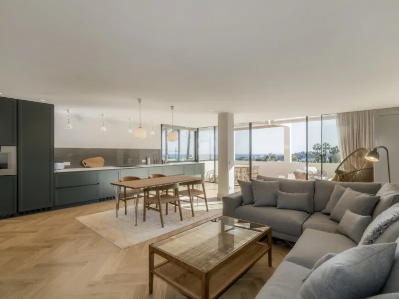 Step into luxury with this newly renovated 2-bedroom, 2-bathroom middle-floor apartment in the heart of Nueva Andalucía. Designed for modern living, it features a state-of-the-art Gaggenau kitchen, elegant herringbone wood flooring, and a spacious southwe