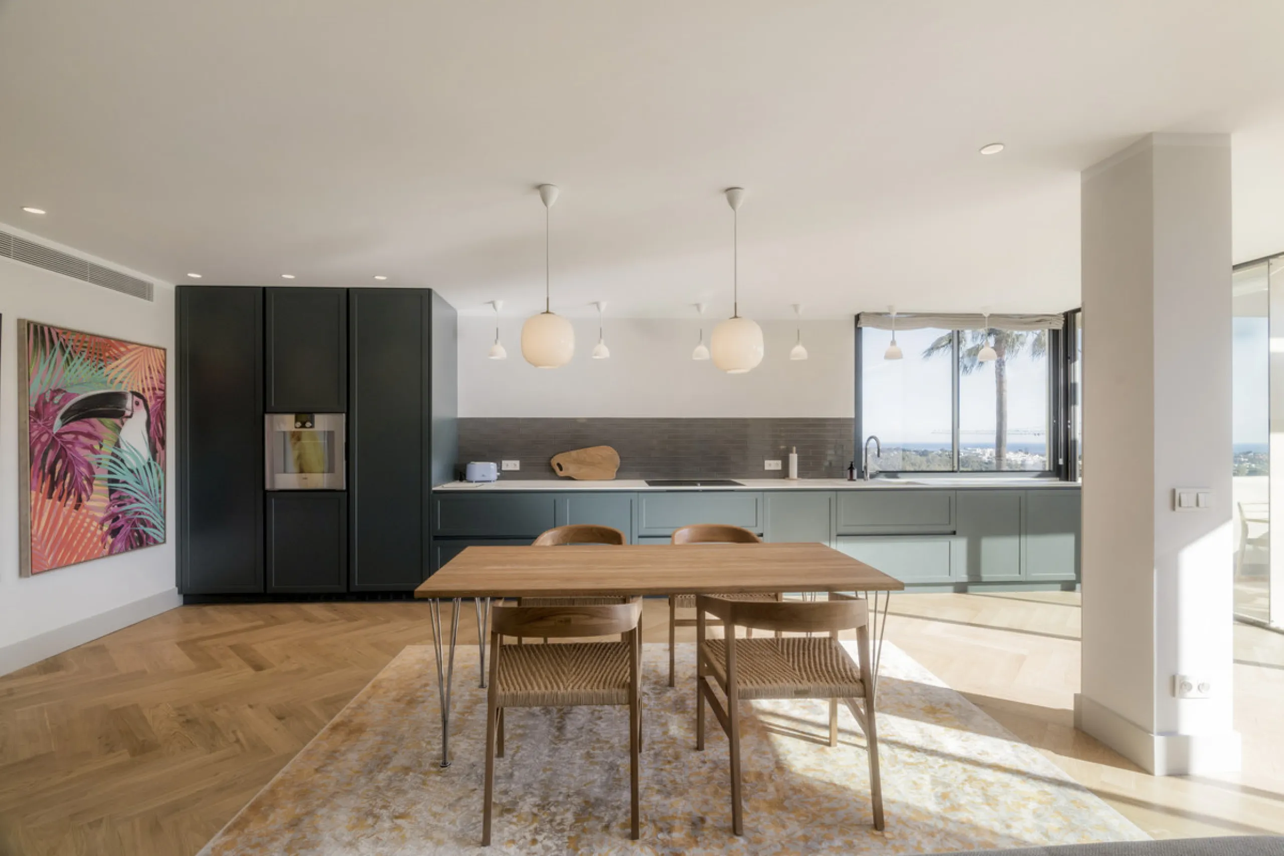 Step into luxury with this newly renovated 2-bedroom, 2-bathroom middle-floor apartment in the heart of Nueva Andalucía. Designed for modern living, it features a state-of-the-art Gaggenau kitchen, elegant herringbone wood flooring, and a spacious southwe