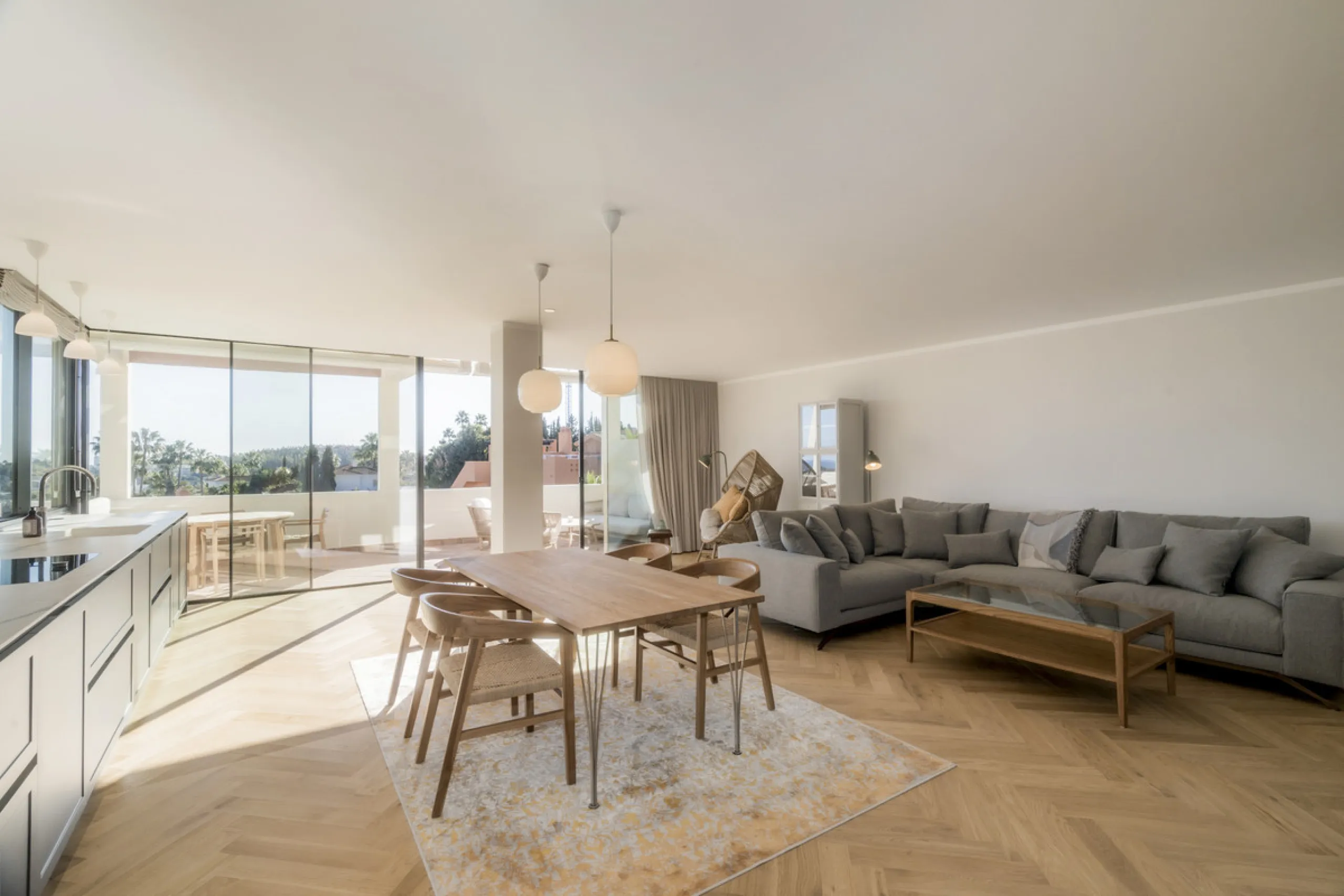 Step into luxury with this newly renovated 2-bedroom, 2-bathroom middle-floor apartment in the heart of Nueva Andalucía. Designed for modern living, it features a state-of-the-art Gaggenau kitchen, elegant herringbone wood flooring, and a spacious southwe