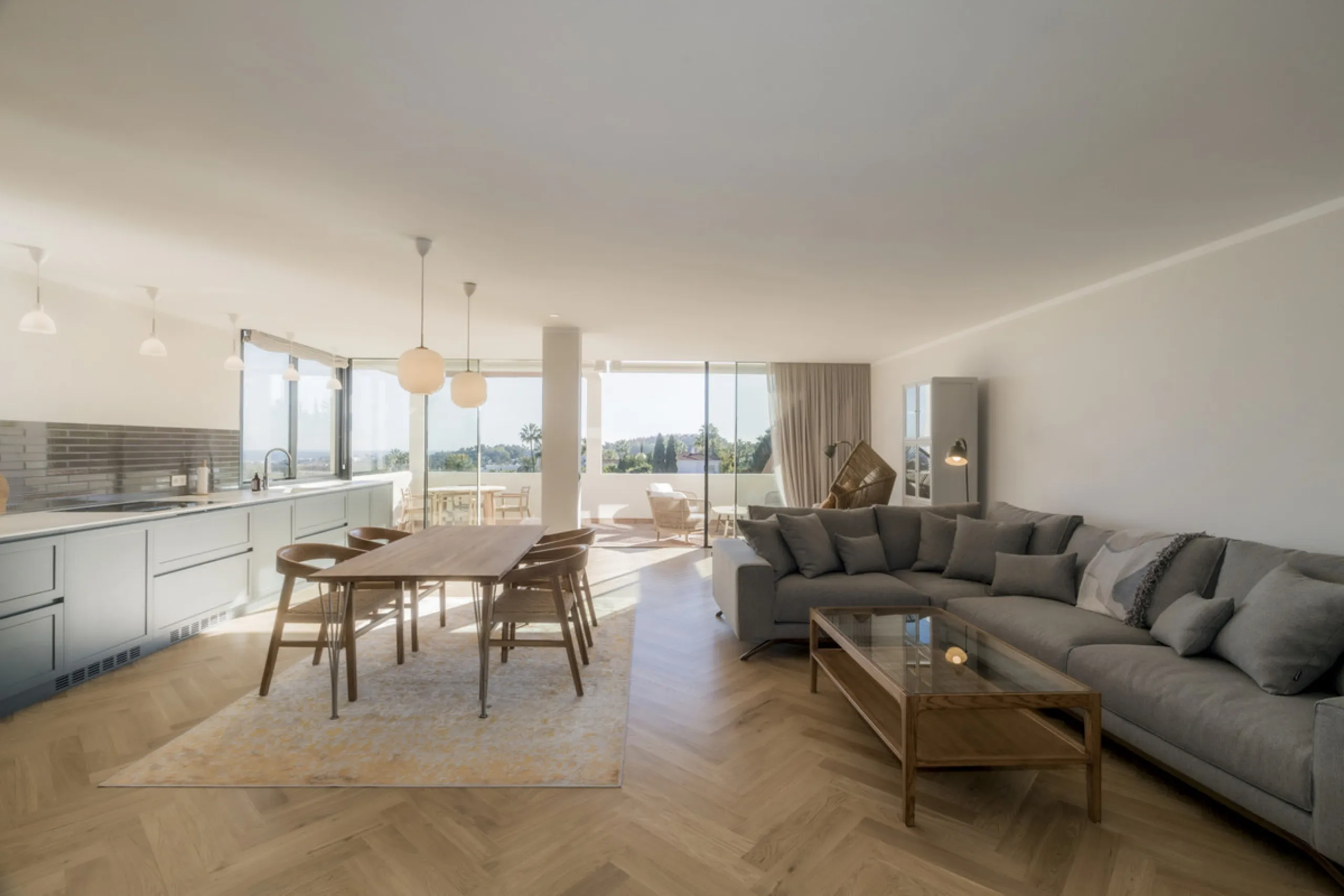 Step into luxury with this newly renovated 2-bedroom, 2-bathroom middle-floor apartment in the heart of Nueva Andalucía. Designed for modern living, it features a state-of-the-art Gaggenau kitchen, elegant herringbone wood flooring, and a spacious southwe