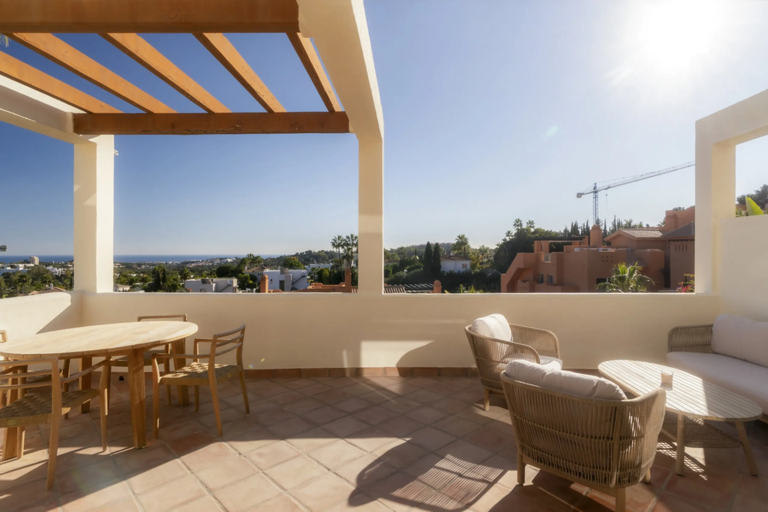 Step into luxury with this newly renovated 2-bedroom, 2-bathroom middle-floor apartment in the heart of Nueva Andalucía. Designed for modern living, it features a state-of-the-art Gaggenau kitchen, elegant herringbone wood flooring, and a spacious southwe