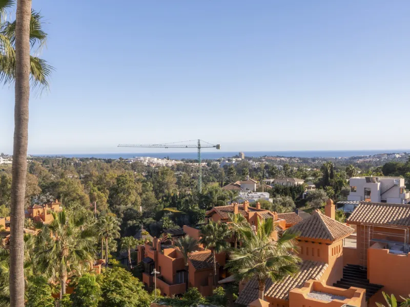 Step into luxury with this newly renovated 2-bedroom, 2-bathroom middle-floor apartment in the heart of Nueva Andalucía. Designed for modern living, it features a state-of-the-art Gaggenau kitchen, elegant herringbone wood flooring, and a spacious southwe