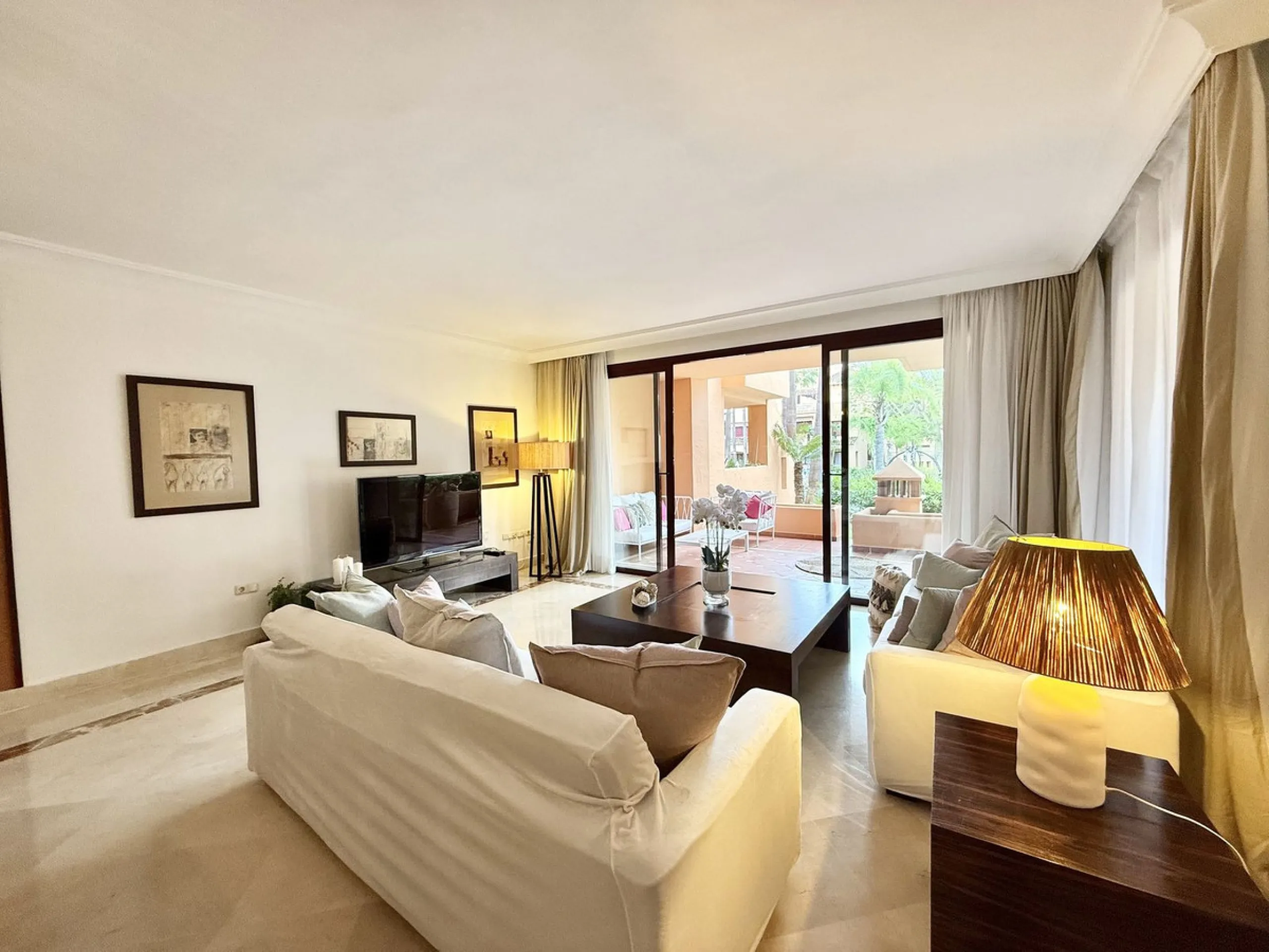 This magnificent frontline beach ground floor apartment is part of an exclusive gated community of only 80 homes. Surrounded by lush mature tropical gardens, it offers a tranquil and sophisticated ambience. The property includes a private underground park