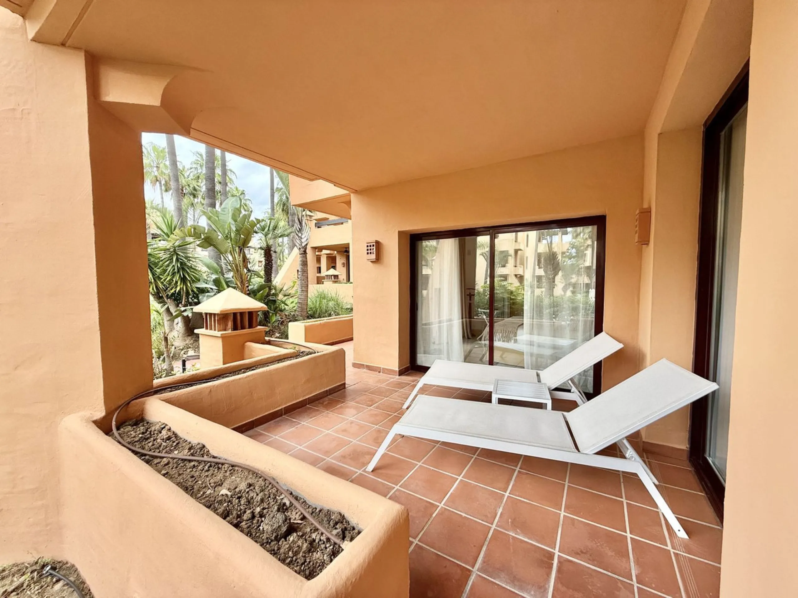 This magnificent frontline beach ground floor apartment is part of an exclusive gated community of only 80 homes. Surrounded by lush mature tropical gardens, it offers a tranquil and sophisticated ambience. The property includes a private underground park