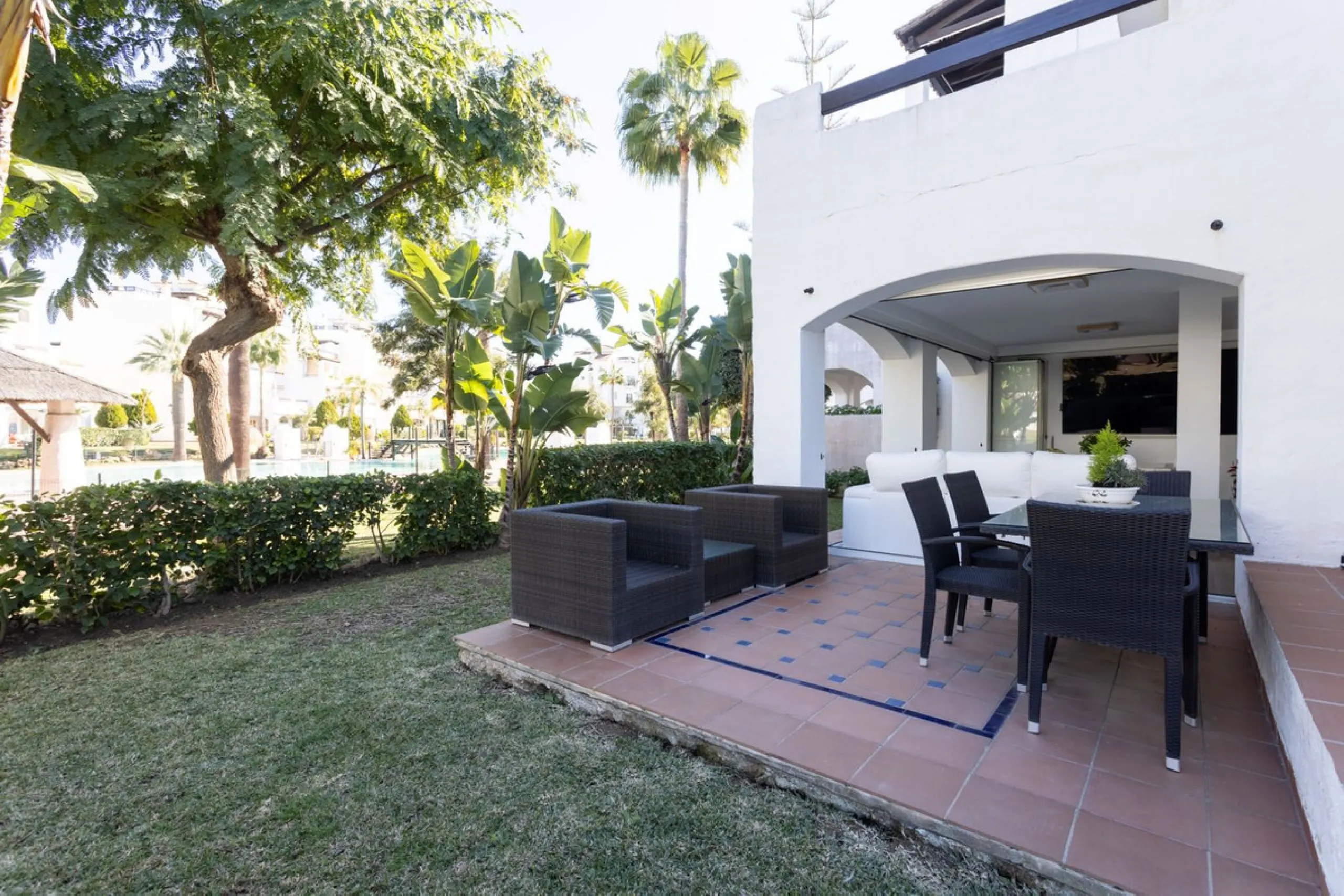 Discover luxury and comfort in this exclusive ground floor apartment in the prestigious urbanization of Las Adelfas!.