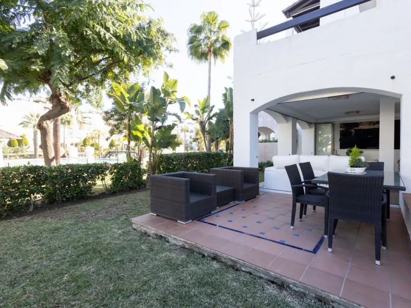 Discover luxury and comfort in this exclusive ground floor apartment in the prestigious urbanization of Las Adelfas!.