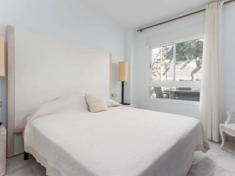 Discover luxury and comfort in this exclusive ground floor apartment in the prestigious urbanization of Las Adelfas!.