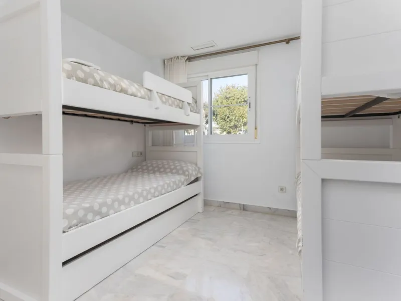 Discover luxury and comfort in this exclusive ground floor apartment in the prestigious urbanization of Las Adelfas!.