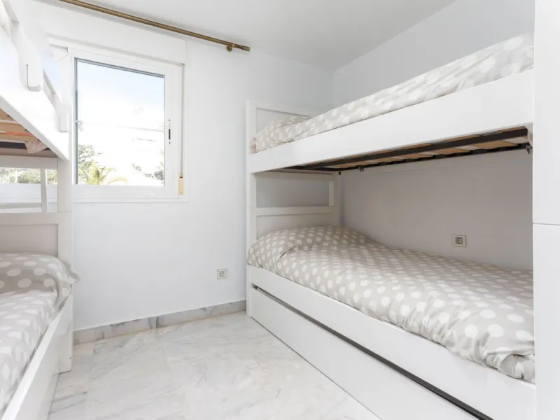 Discover luxury and comfort in this exclusive ground floor apartment in the prestigious urbanization of Las Adelfas!.