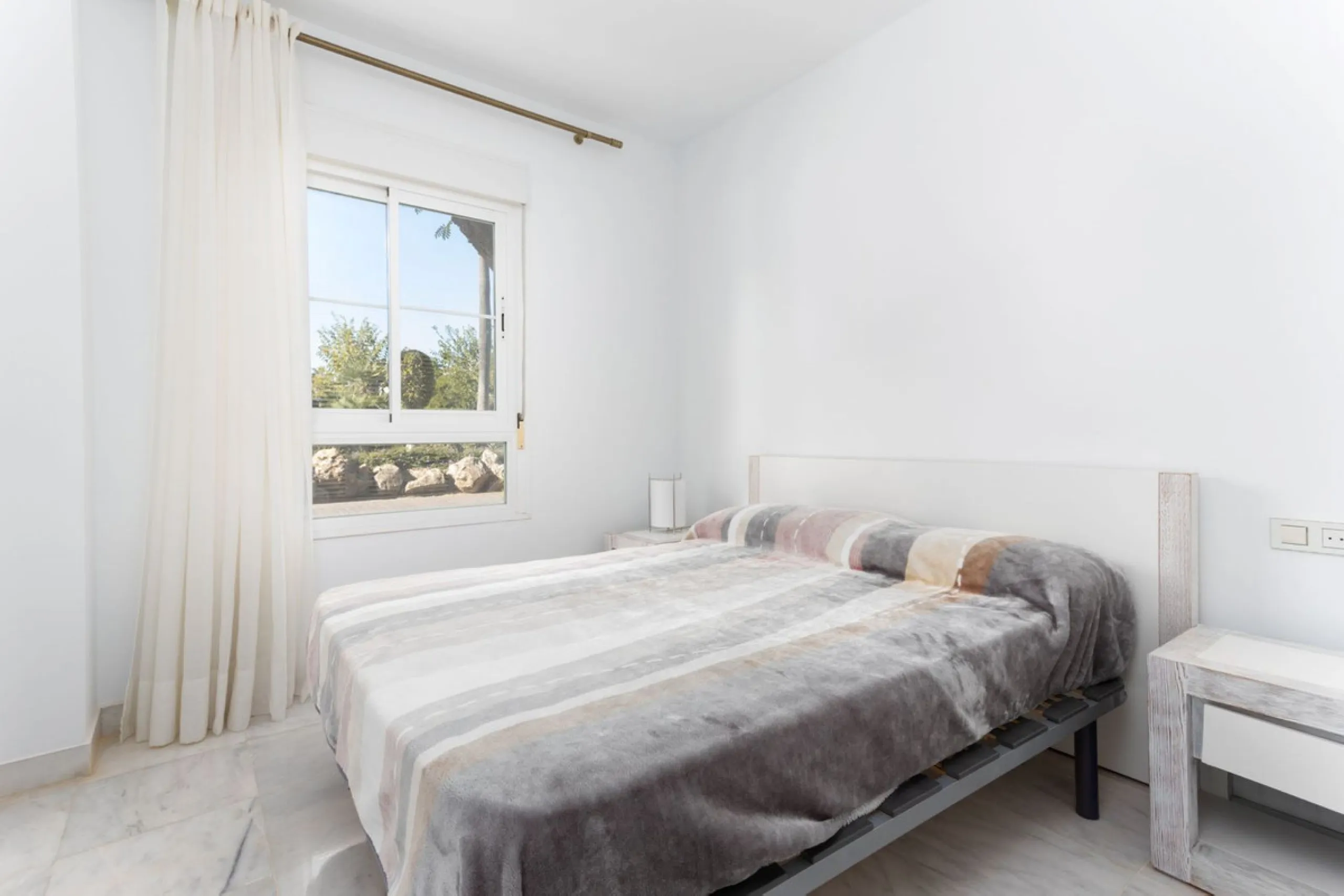 Discover luxury and comfort in this exclusive ground floor apartment in the prestigious urbanization of Las Adelfas!.