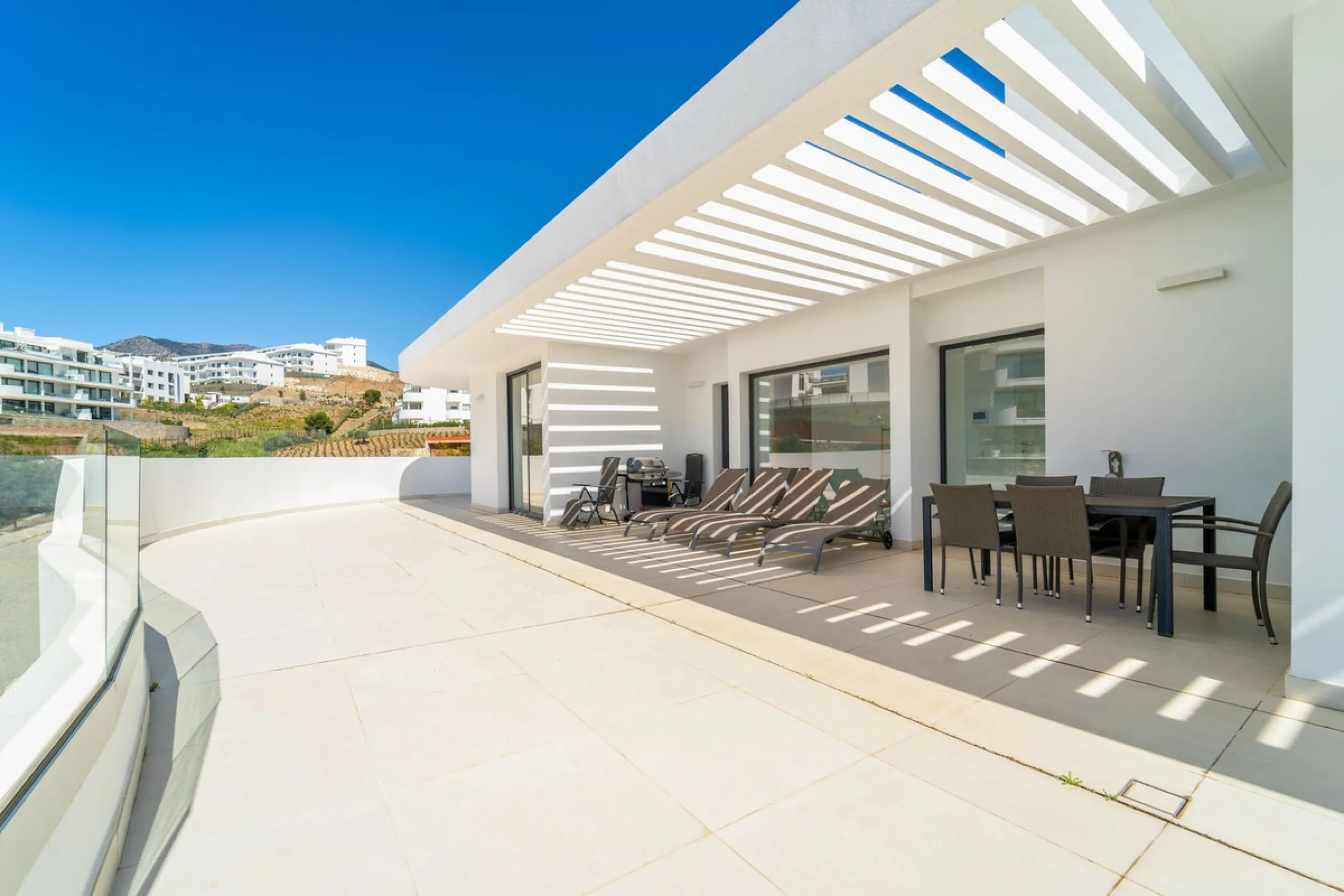 Luxury west facing penthouse, located in the exclusive urbanization of Higuerón West. Consists of entrance, hall way, spacious living-dining room with floor to ceiling glass sliding doors leading out to a large wrap around terrace of 158m2, with views of 