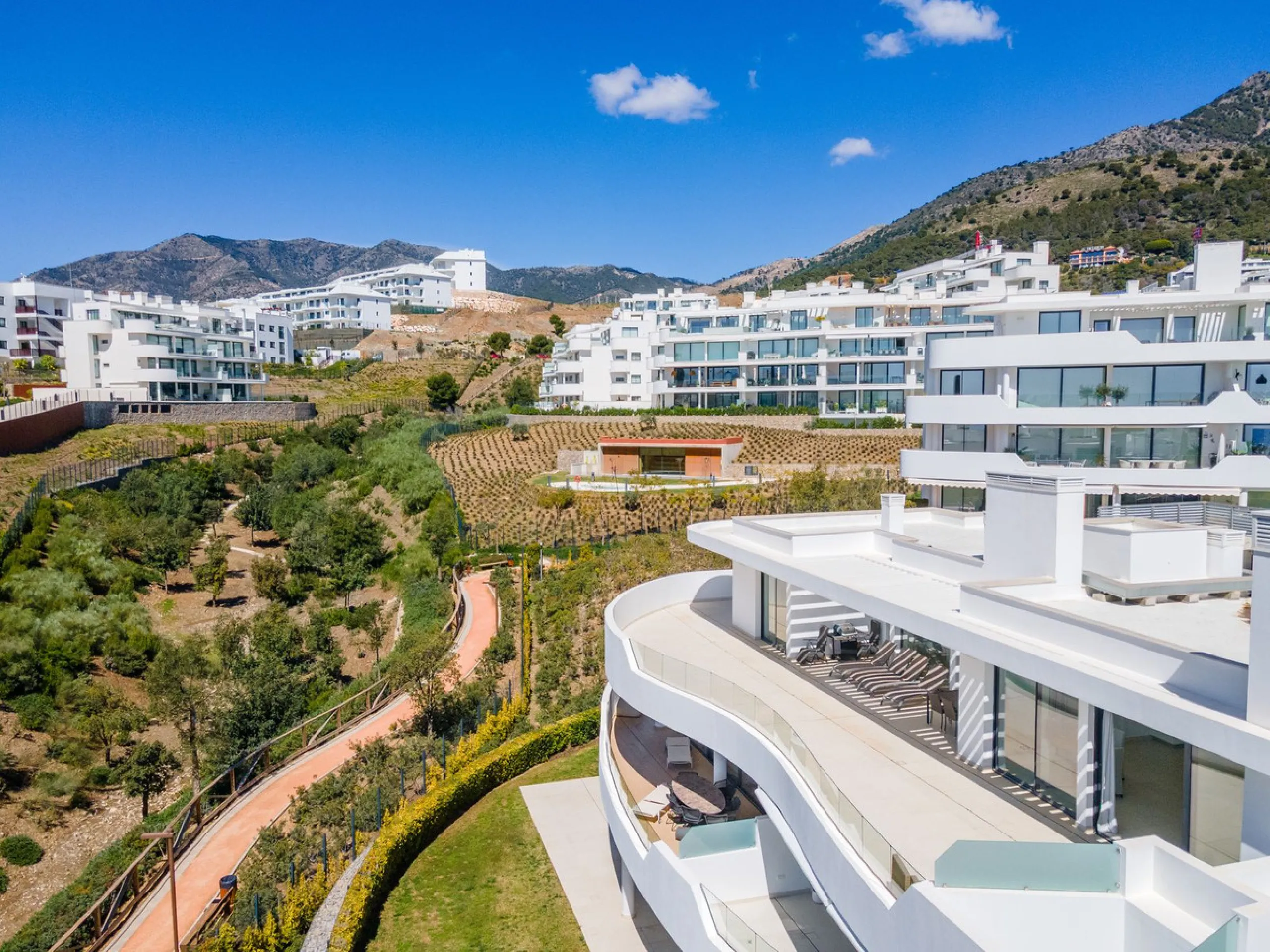 Luxury west facing penthouse, located in the exclusive urbanization of Higuerón West. Consists of entrance, hall way, spacious living-dining room with floor to ceiling glass sliding doors leading out to a large wrap around terrace of 158m2, with views of 