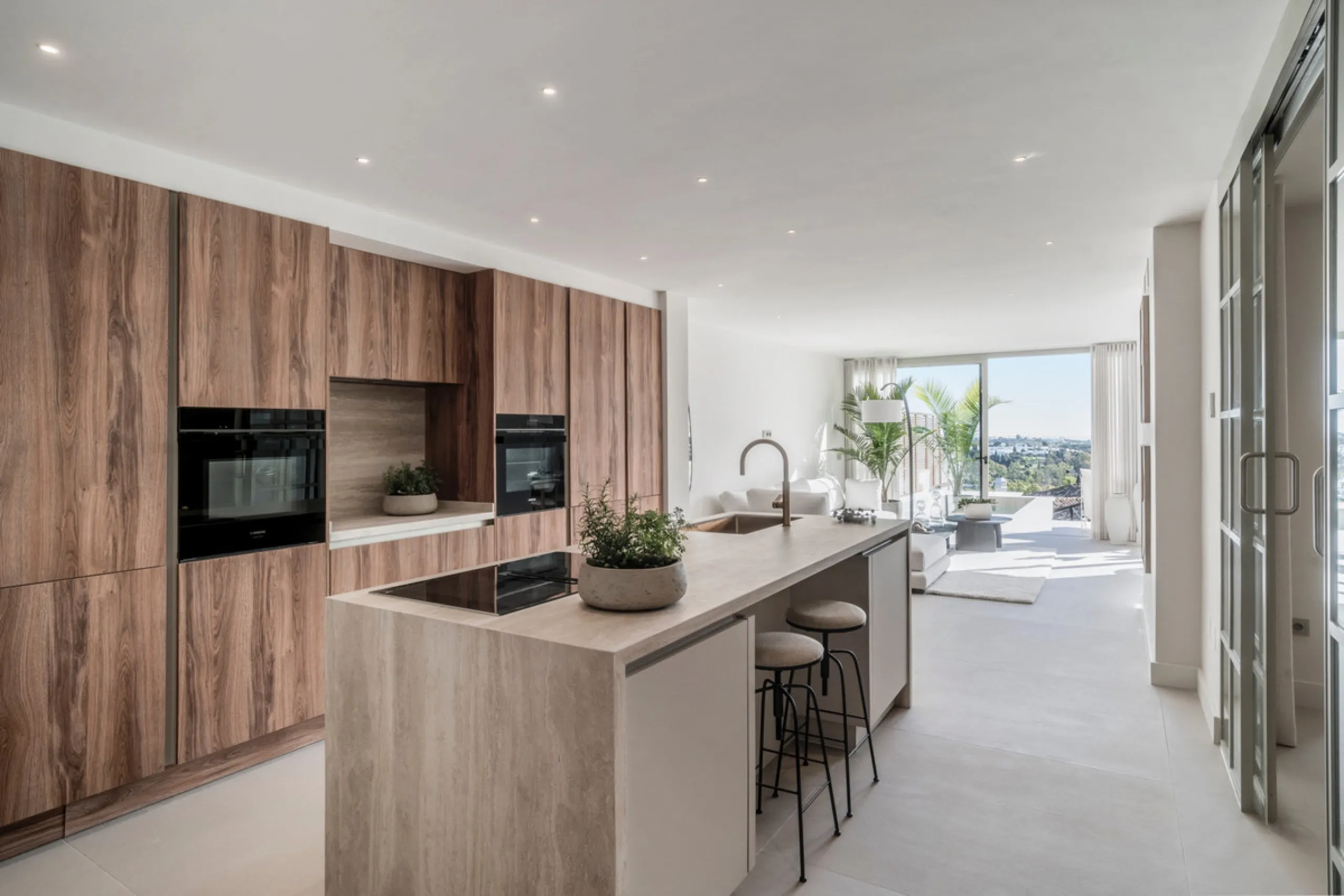 This exquisite 3-bedroom ground-floor apartment in Nueva Andalucía, Marbella, epitomizes modern luxury and comfort. Recently renovated to the highest standards, the property features an open-plan living and dining area, perfectly designed for seamless ent