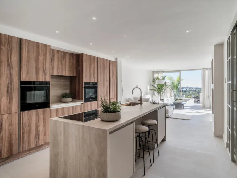 This exquisite 3-bedroom ground-floor apartment in Nueva Andalucía, Marbella, epitomizes modern luxury and comfort. Recently renovated to the highest standards, the property features an open-plan living and dining area, perfectly designed for seamless ent