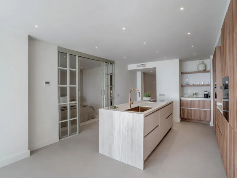 This exquisite 3-bedroom ground-floor apartment in Nueva Andalucía, Marbella, epitomizes modern luxury and comfort. Recently renovated to the highest standards, the property features an open-plan living and dining area, perfectly designed for seamless ent