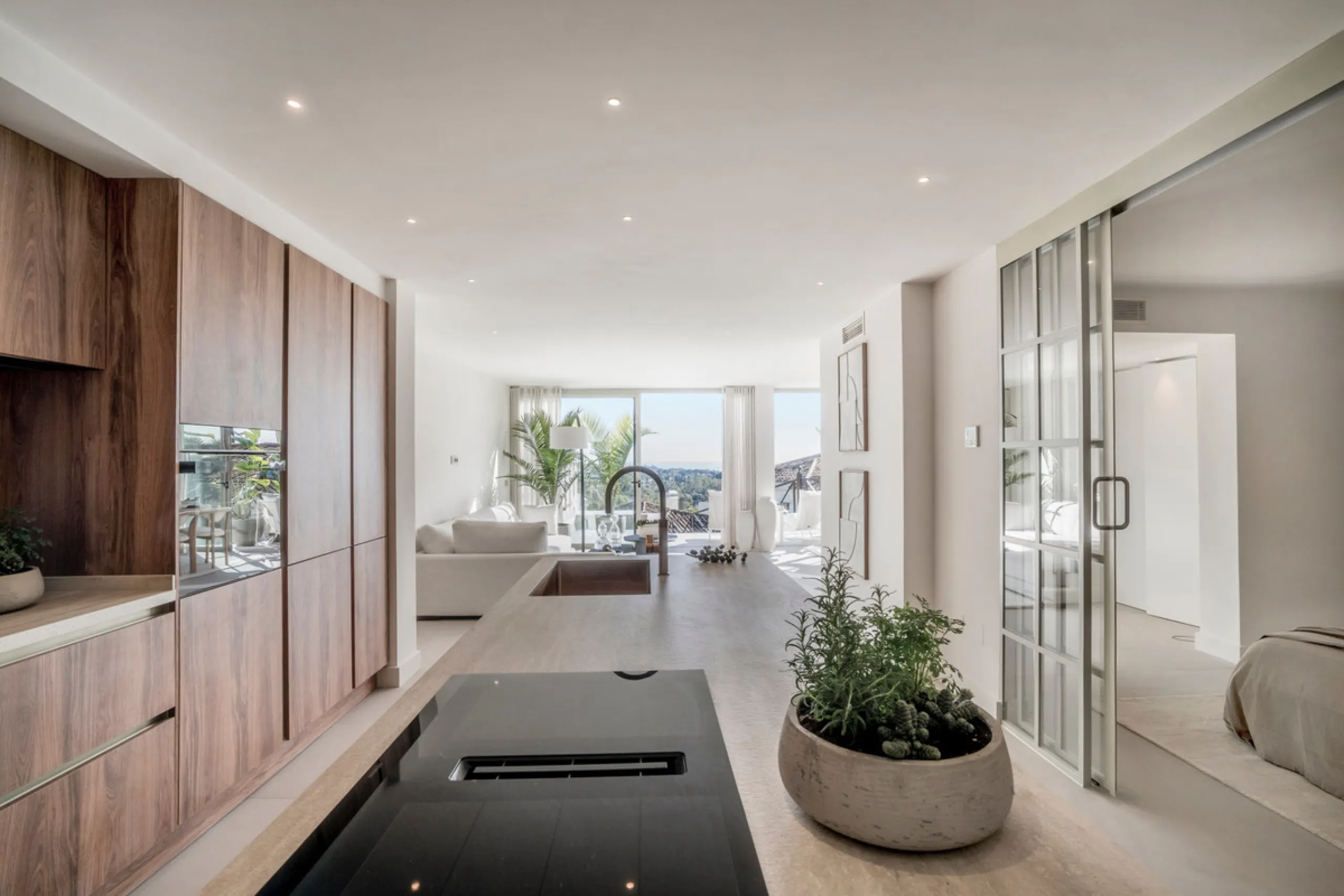 This exquisite 3-bedroom ground-floor apartment in Nueva Andalucía, Marbella, epitomizes modern luxury and comfort. Recently renovated to the highest standards, the property features an open-plan living and dining area, perfectly designed for seamless ent